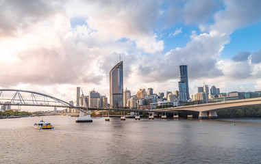 Fototapeta na wymiar View over the CBD of Brisbane and city skyline. Beautiful sunset panorama over the city and river. Brisbane, Queenlsland. Southbank