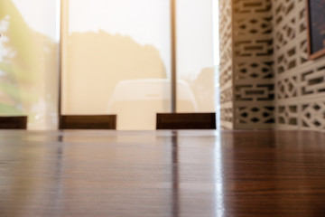 Wooden table and chairs with blurred background