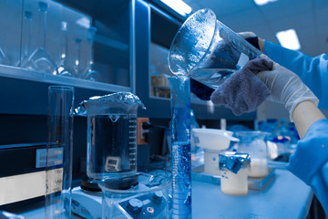 Asian scientist working in the lab,Experiment for customer,Using the formula, the physics and chemistry to calculate the value of the experiment,Thailand people