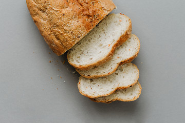 Slices bread loaf bread gray background top view