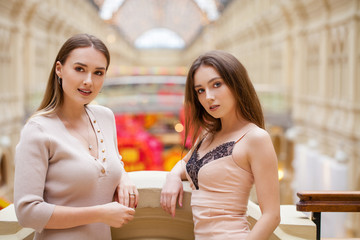 Two brunette young women, indoor