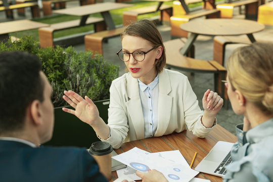 Clever awesome businesswoman explaining new success project