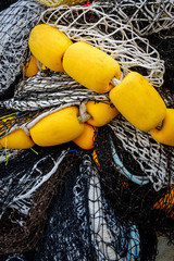 Close up of various fishing nets bundled together