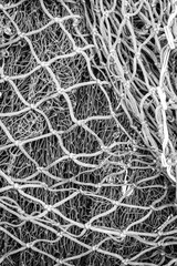 Close up of various fishing nets bundled together