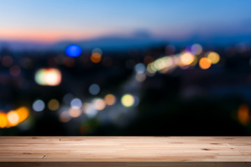 empty table from a light wood with bokeh background