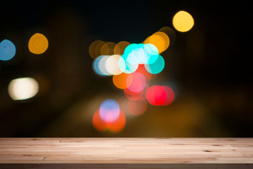 empty table from a light wood with bokeh background