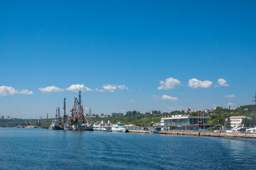 Fototapeta premium Ships and cranes in the river port of Ulyanovsk.