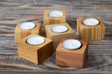 Texture of wooden candle holders with tea candles