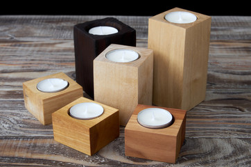 Texture of wooden candle holders with tea candles