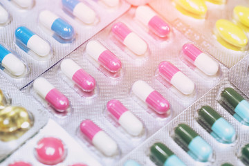 close up pharmaceuticals antibiotics pills medicine in blister packs. colorful antibacterials pills Pharmacy background. capsule pill medicine Antimicrobial drug resistance. Pharmaceutical industry