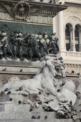 Obraz premium Group of Pigeons on Lion head statue at Piazza Duomo of Milano Italy, dirty from bird pooping shit on attractive sculpture art, travel destination backgrounds