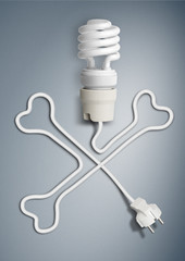 danger electricity concept, light bulb with cable as bone skull