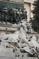 Group of Pigeons on Lion head statue at Piazza Duomo of Milano Italy, dirty from bird pooping shit on attractive sculpture art, travel destination backgrounds