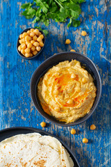 hummus on a wooden surface