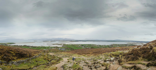 Fototapeta na wymiar Panorama View from a path on a Croagh Patrick trail, Near Westport, county Mayo, Ireland.