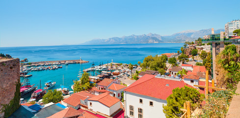 Naklejka na ściany i meble Old town (Kaleici) in the background Konyaalti beach and mountains - Antalya, Turkey