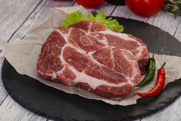 Raw pork neck steak