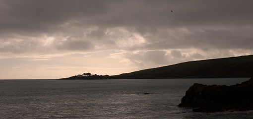 Moody evening light on the Cornish coast near Fowey, Cornwall, England, UK.