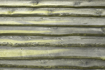Texture of old weathered boards. Natural background. A fence of boards.