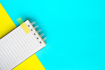 Notebook on Blue and yellow background