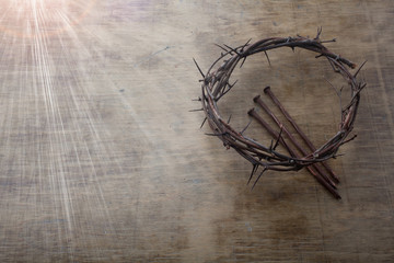 Jesus Crown Thorns and nails on Old and Grunge Wood Background. Vintage Retro Style. Free space for...
