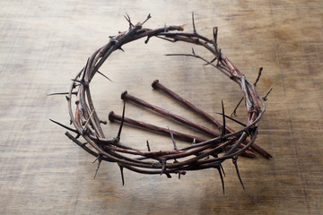 Fototapeta na wymiar Jesus Crown Thorns and nails on Old and Grunge Wood Background. Vintage Retro Style.