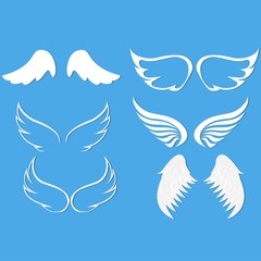 angel wings set blue background