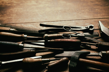 Dark jumble of old vintage hand tools