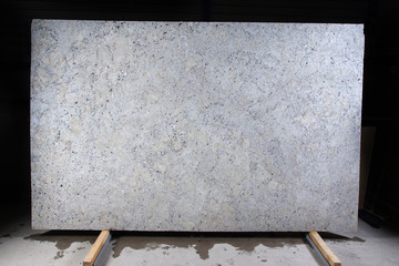 Natural stone of white color with dark specks, called granite Fantastic White