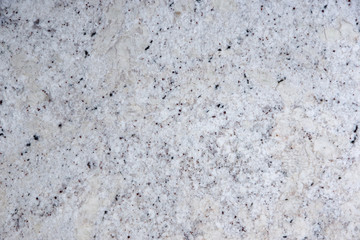 Background natural white stone with black dots, called granite Fantastic White
