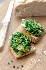 two cereal sandwiches with chopped spinach, egg and cheese cream , organic healthy food