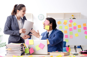 Two colleagues employees working in the office