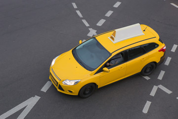 taxi moves on the city street