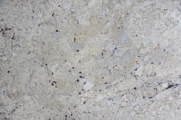 Background natural stone granite beige with dark specks, called Bianco Romano