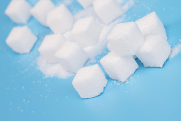 background of sugar cubes. Sugar with copy space. White sugar on turquoise blue background. soft...