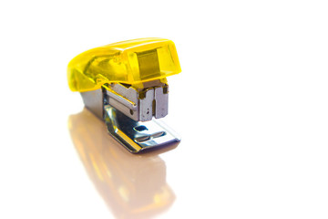 yellow stapler isolated on white background