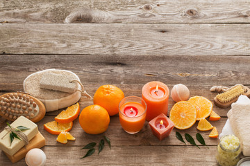 spa concept with orange fruits on old wooden background