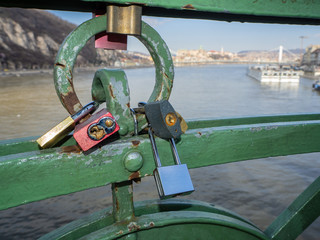 Budapest, Hungary. Set of padlocks with messages of love at the Liberty Bridge or Freedom Bridge...