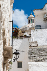 Walking in Locorotondo. Narrow streets and white houses. Dreamlike Puglia, Italy