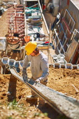 Construction worker on a heavy site doing hard work.
