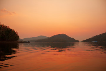 Last sun light in evening weather with the lake and mountain view to relaxing time or time of freedom.