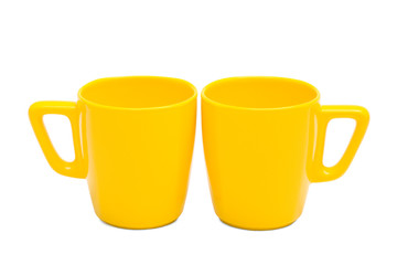two yellow mug