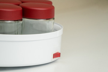 Yogurt maker closeup on the kitchen table