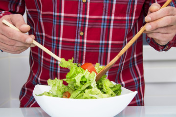 man holding salad boll, diet and health concept