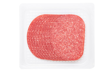 Salami slices on white background.