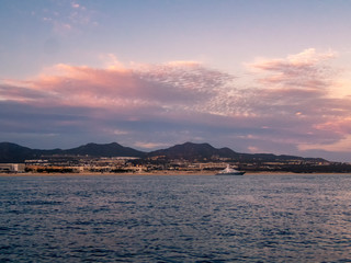 The colours of a Pacific sunset over the resort of Cabo San Lucas in Baja California, Mexico