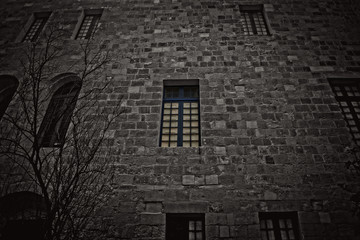Fototapeta na wymiar An old Wall with a Blue Window