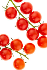 mature cherry tomatoes branch of cherry vegetables on a white background close-up of a bright delicious