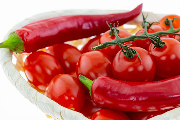 dark burgundy pod pepper spicy branch of tomato cherry salsa base basket wicker