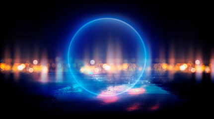 Neon circle, wet asphalt, reflection. Neon circle with the center of a dark empty scene with spotlights. Abstract light. Lights of the night city, abstract light bokeh, smog, smoke.